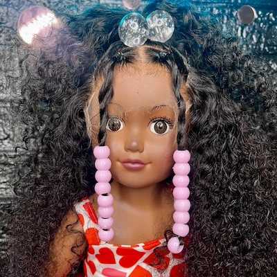 Custom doll wigs on successful black parenting magazine