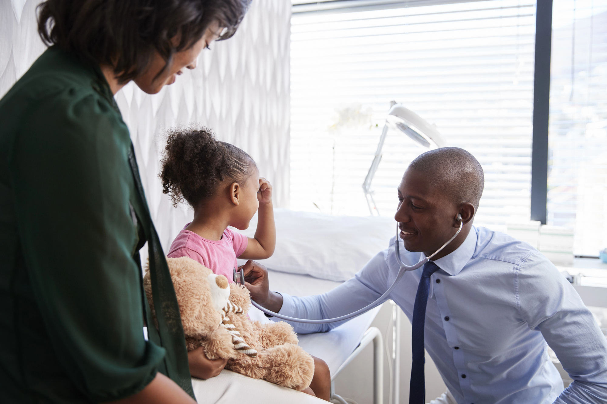 5 signs your child may need a pediatric specialist African american family sees a pediatric specialist