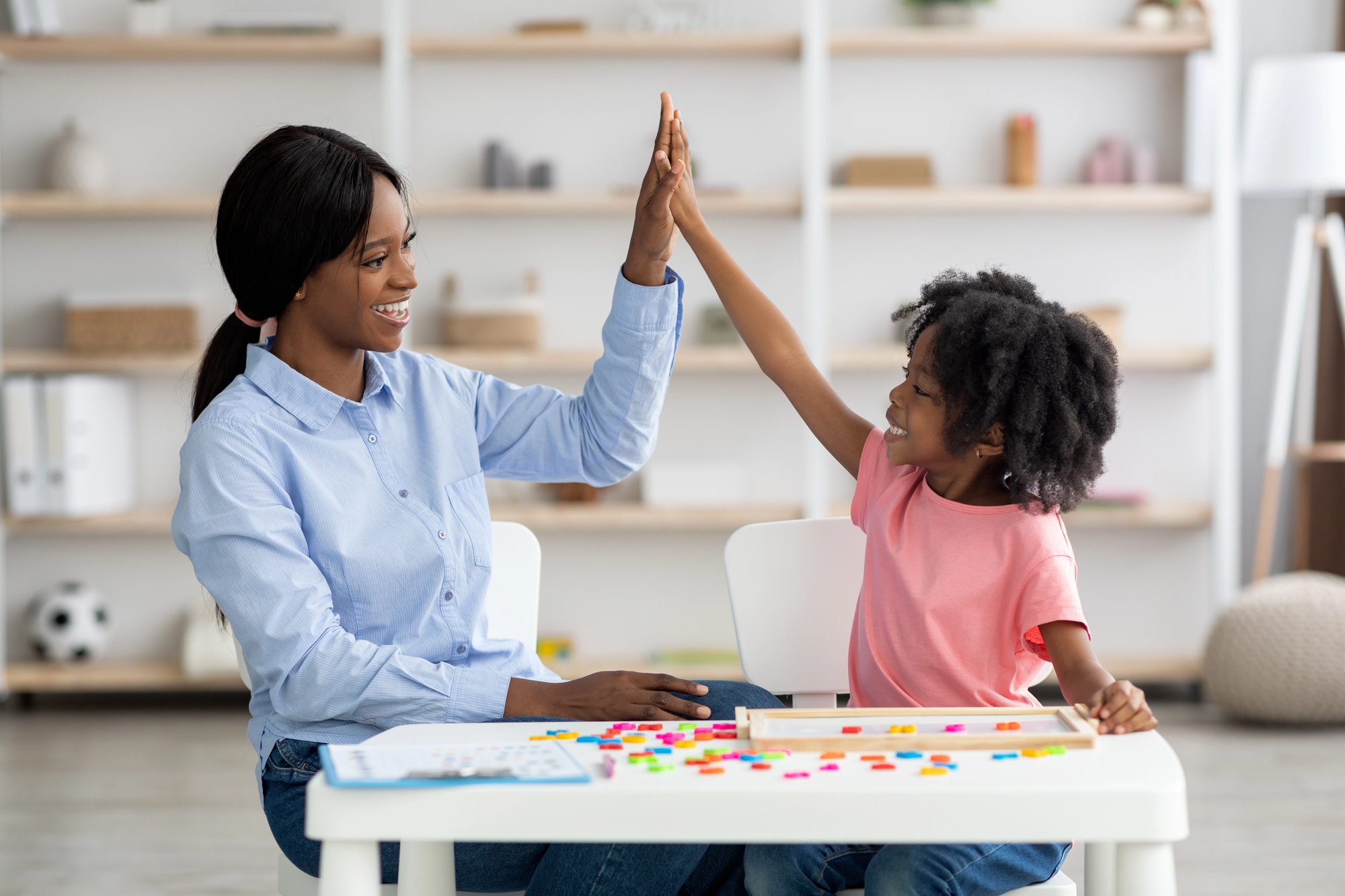 How parents can transition into special education careers and advocate for their own children An african american mom learning special education to advocate for her child for an article about how parents can transition into special education careers and advocate for their own children