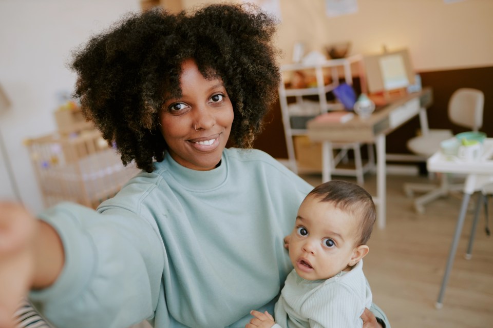 Choosing the ideal daycare: what parents should keep in mind An african american mother is choosing the ideal daycare for her child while standing in a nursery.