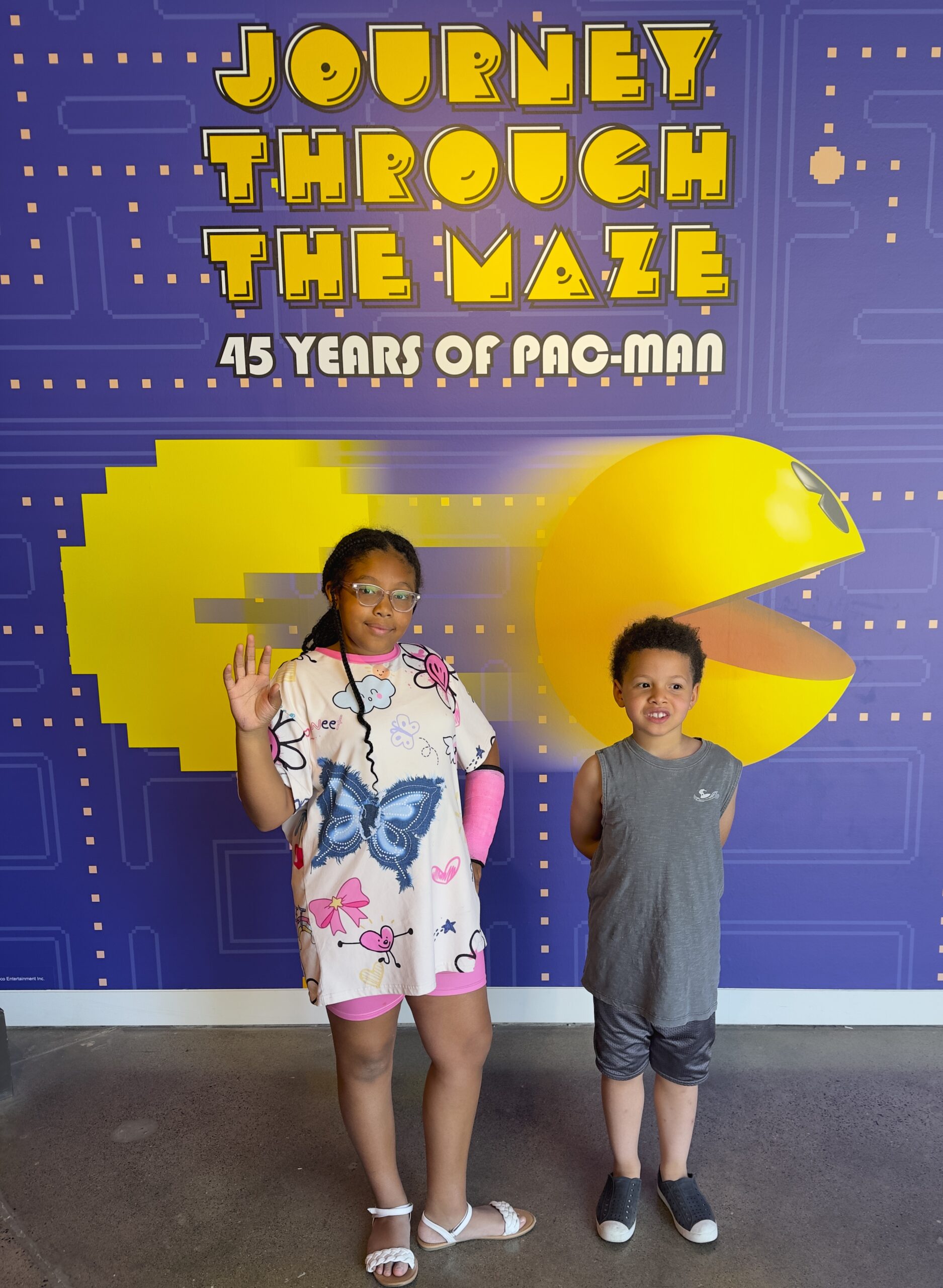 Irvine, california: a family-friendly option with plenty to experience and a few lessons learned The pac-man exhibit in irvine, california with a young black girl with braids and a young boy.