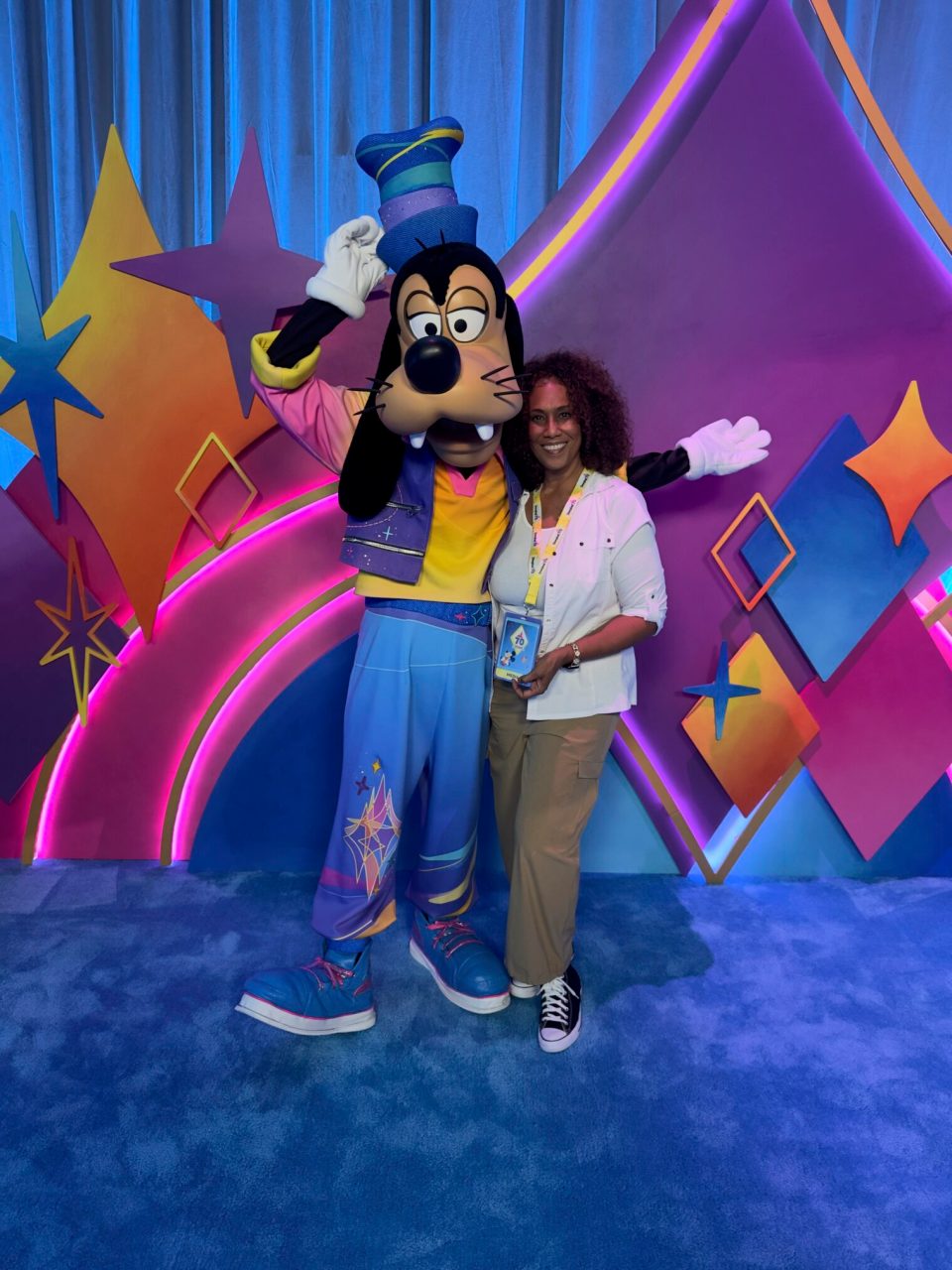 Janice robinson-celeste with goofy at disneyland's celebrate happy 70th anniversary.