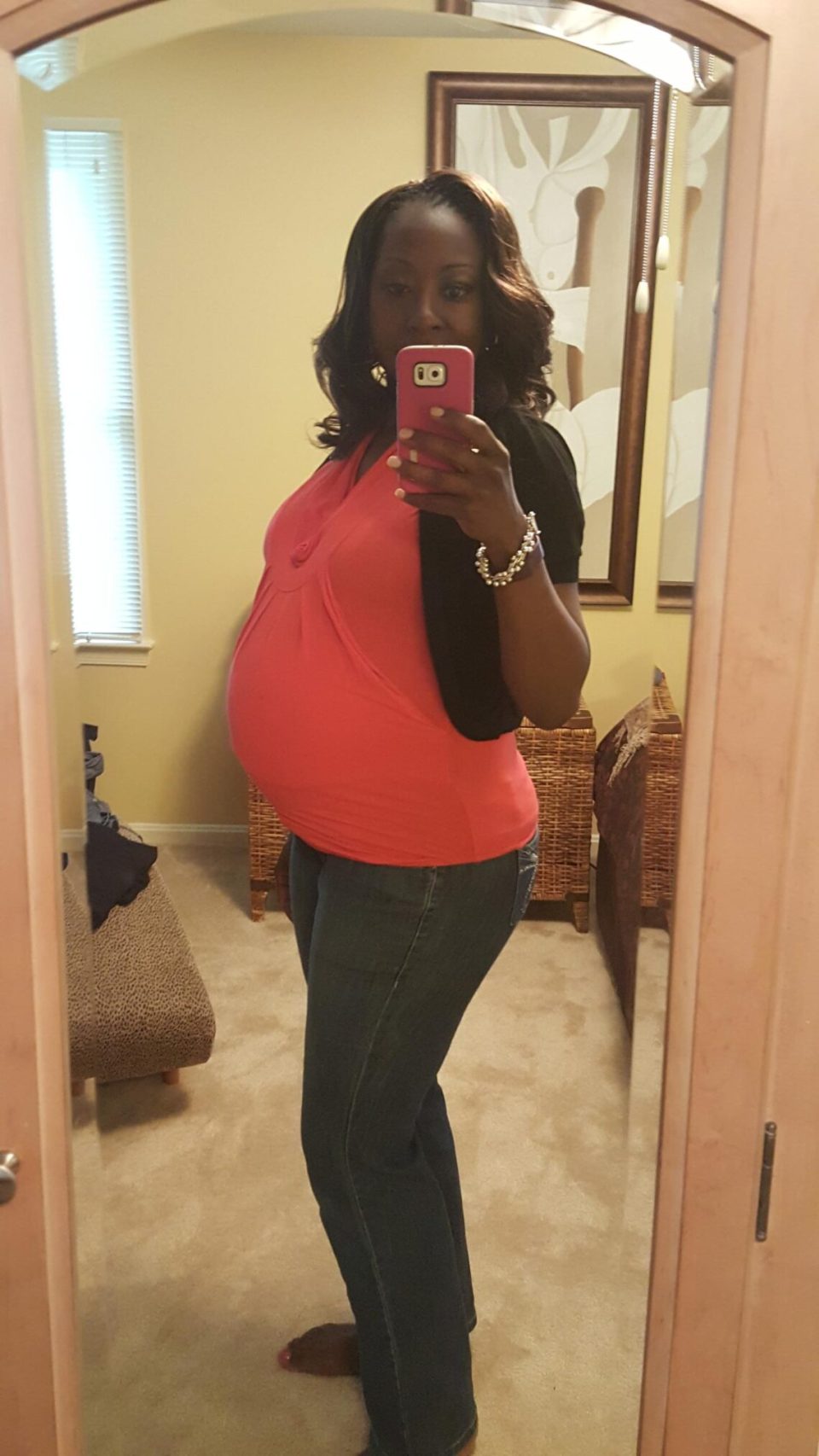 Jana capturing her pregnancy in a mirror selfie, proud and radiant in her third trimester for an article about black, single, and proud: why more black women are choosing motherhood on their own terms.
