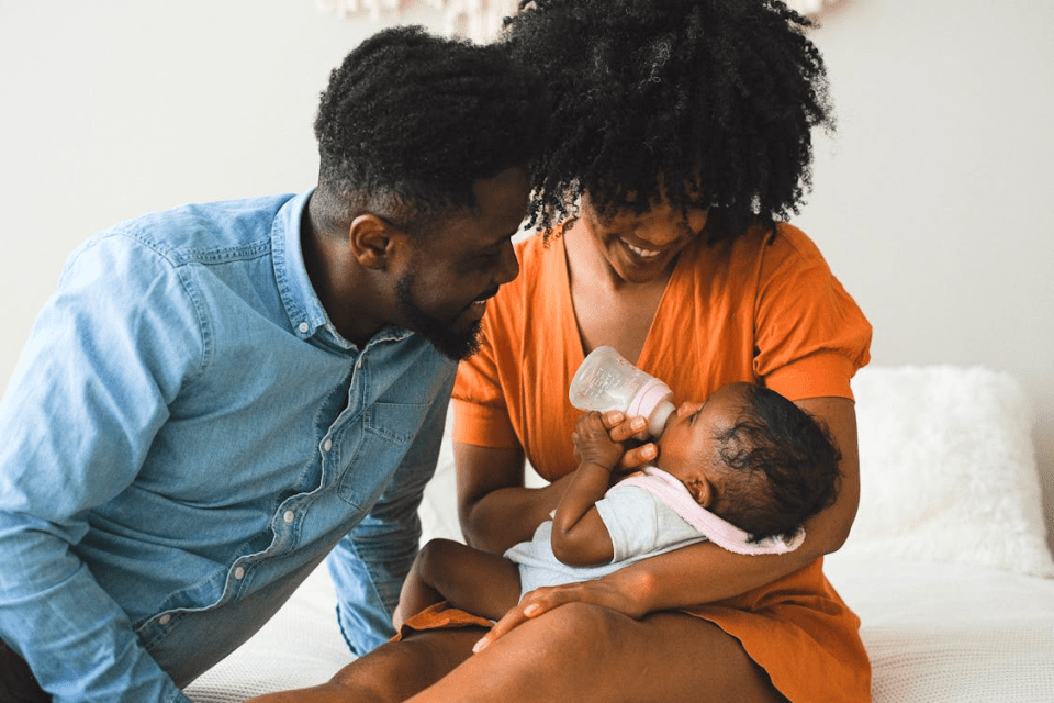 Steps to build a spiritual support network for black parents An african american couple feeds their child a bottle in an article titled, steps to build a spiritual support network for black parents.